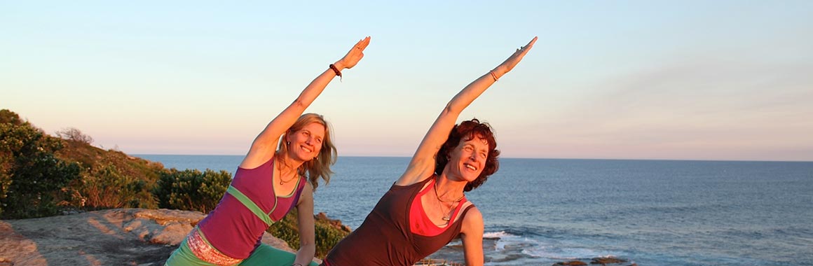 Dru yoga bhima posture by the beach