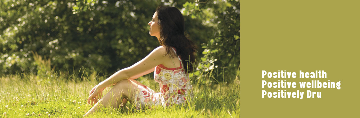 woman sitting in field